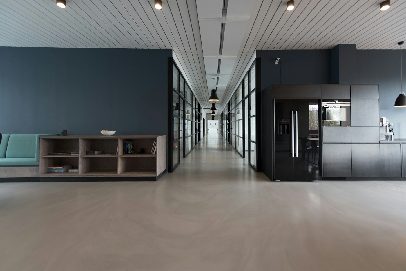 Illustrative contemporary workspace with glass meeting rooms